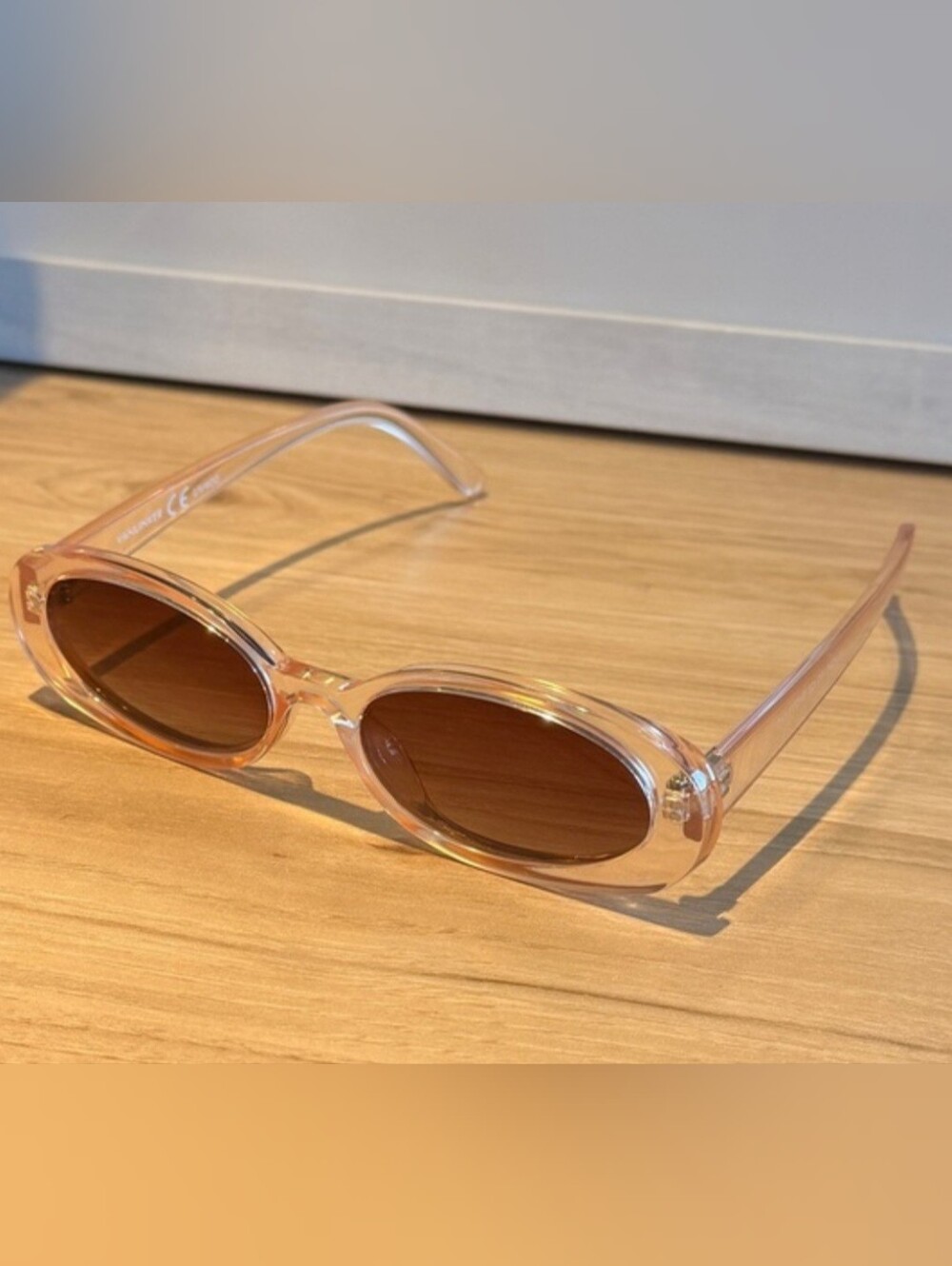 Clear Pink Oval Sunglasses with Brown Lenses